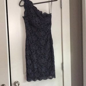 Lace one- shoulder cocktail dress.